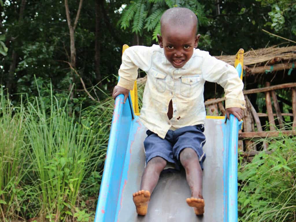 Malawi photo child on slide