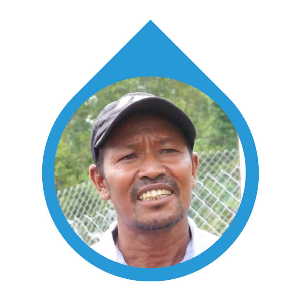 Portrait of community member sharing their experience with the water point constructed with Made Blue.