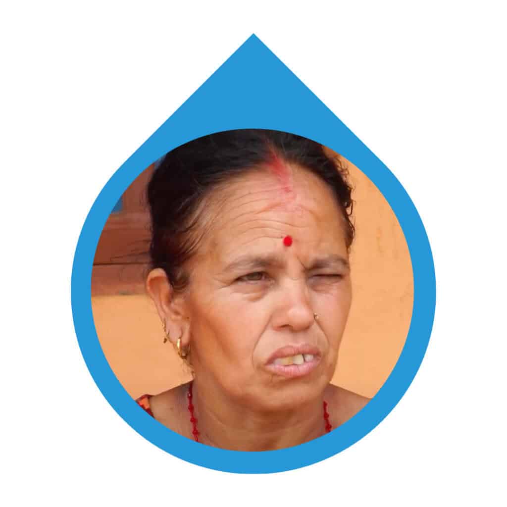 Portrait of community member sharing their experience with the water point constructed with Made Blue.