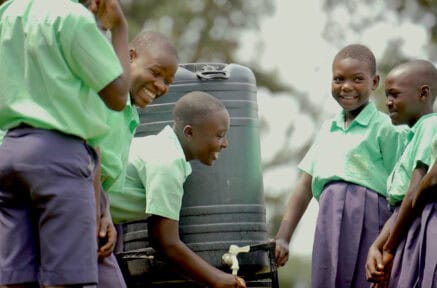 Uganda children using waterpoint